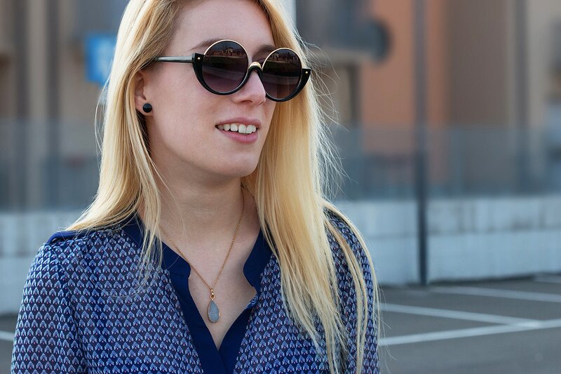 Fashion blogger Aurora Berill wearing FREYRS half frame sunglasses, Angies Glamour Fashion cone earrings