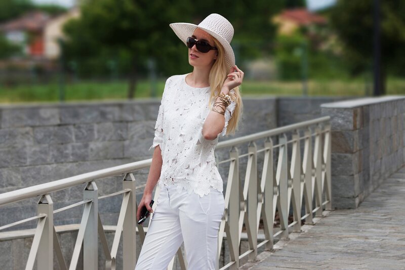 Fashion blogger Aurora Berill wearing a lace floral top and CREW tortoiseshell sunglasses