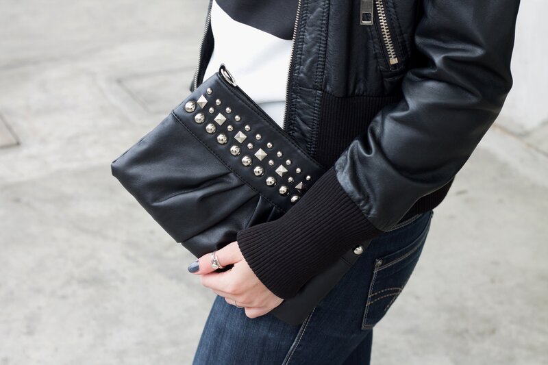 Fashion blogger Aurora Berill wearing a studded purse with metal details in edgy fashion style