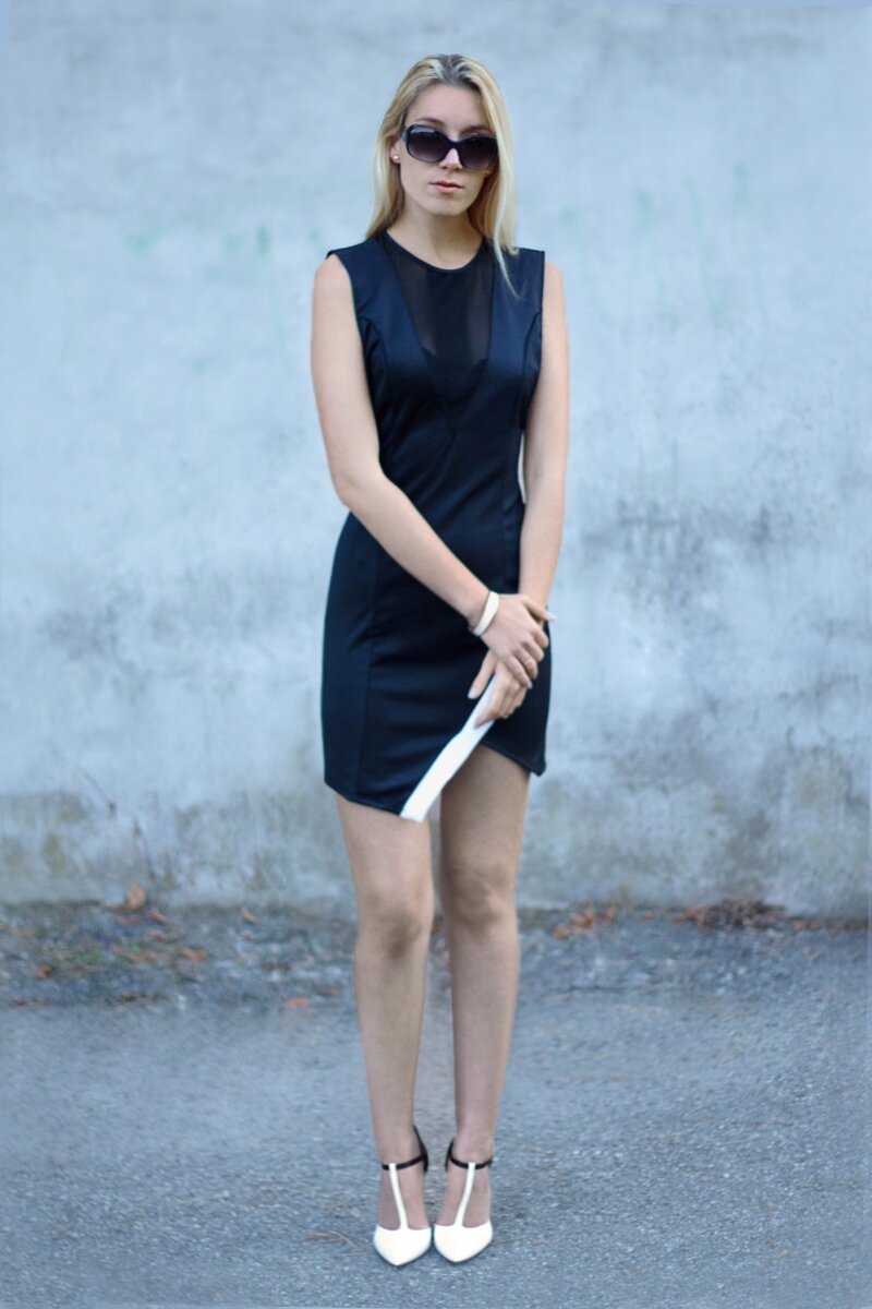 Fashion blogger Aurora Berill wearing a black satin dress with slit