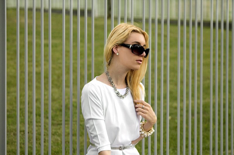 Fashion blogger Aurora Berill wearing Chanel silver stud earrings and H&M sunglasses