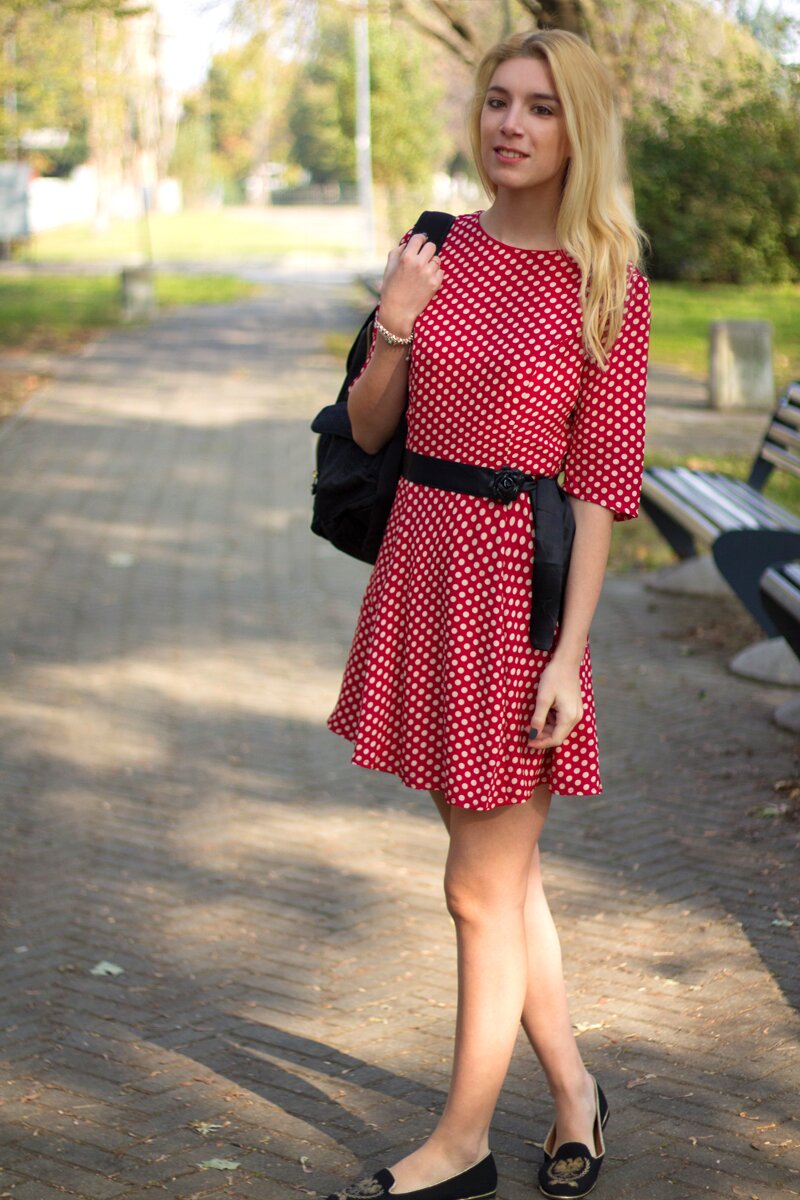 Fashion blogger Aurora Berill wearing a Poppy Lux Evette red polka dot dress