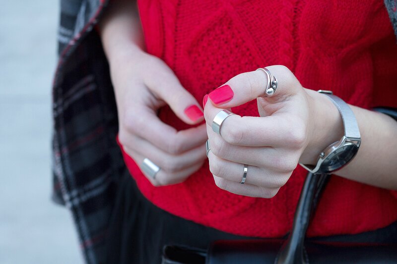 Fashion blogger Aurora Berill wearing a Calvin Klein dress watch and a stackable ring set