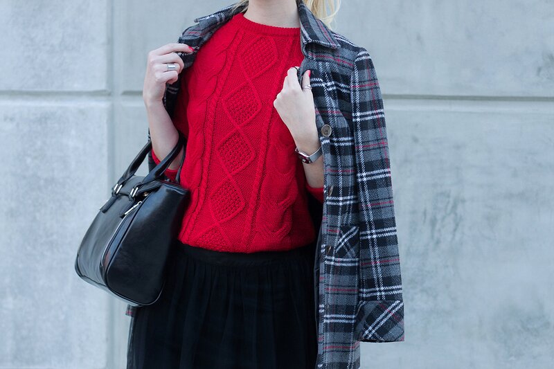 Fashion blogger Aurora Berill wearing a long plaid coat with a winter christmas outfit