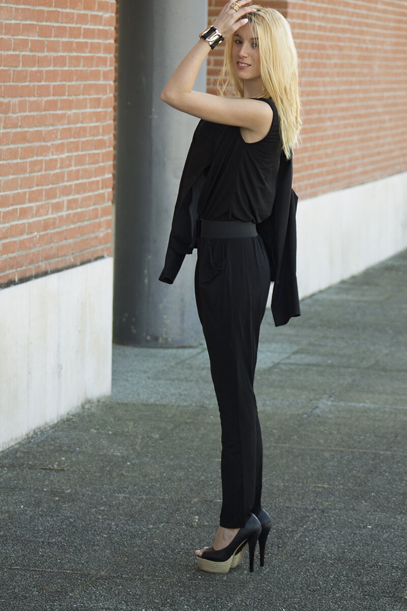 Fashion blogger Aurora Berill wearing a WalG black sleeveless jumpsuit