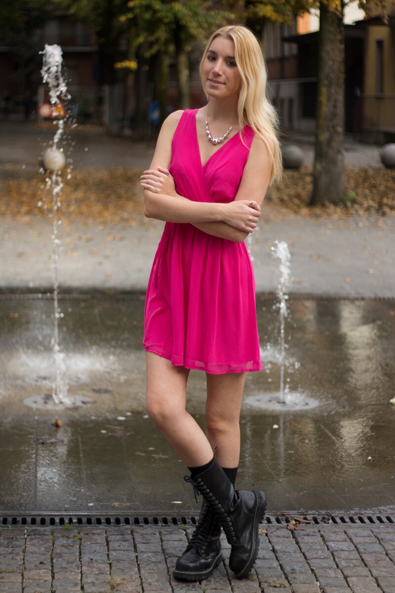 Fashion blogger Aurora Berill wearing a chiffon hot pink dress